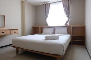 Nice and Comfort Studio Room at Azalea Suites Apartment By Travelio