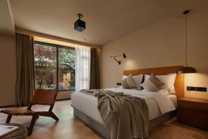 LiJiang Garden vacation PuZhi hotel - 4hvězdičkové hotely ve městě Li-ťiang