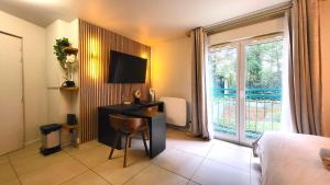 Appartements La Parisienne - Spacieux studio avec parking prive : photos des chambres