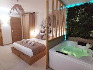 Appartements La Suite Balinaise - Balneo - Wifi - Netflix - Proche centre ville : photos des chambres