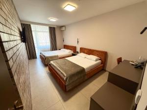 Standard Twin Room room in Komilfo Hotel