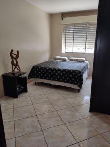 Apartamento de frente com sacada