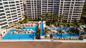 Stunning Beachfront Condo - Sea Views & Pools