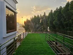 Anushthan Villa a private serviced villa for events and staycation with luxury views of garden and fountain pool in UAE - 乌姆盖万