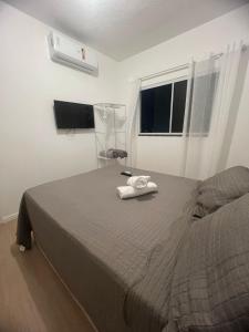 Apartamento aconchegante com piscina à 4km da Praia de Aruana