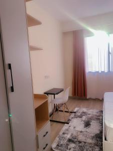 newly furnished apartment with swimming pool, fully equipped gym, private parking space,children playground and unbeatable scenic city views