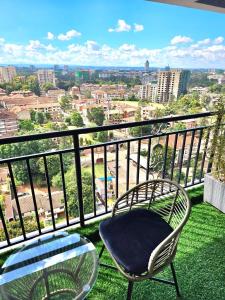 elegant urban escape apartment with heated swimming pool, fully equipped gym,children playing ground,amazing city views and private parking space