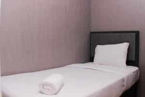 Comfort and Restful 2BR at Bassura City Apartment By Travelio