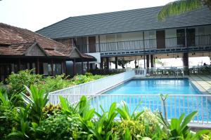 Palm TreeHeritage Beach Resort