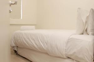 Minimalist and Cozy 3BR at Meikarta Apartment By Travelio