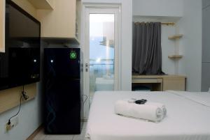 Cozy Brand New Studio Springlake Summarecon Apartment By Travelio