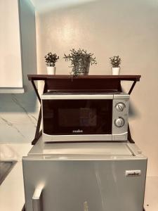 Luxurious 2 Bedroom Oasis in Air Residences with Bar KTV and Games