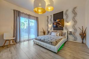 Villas La Villa des Legendes - Spa & Swimming Pool : photos des chambres