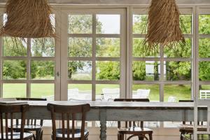 By The Bay A Thatched House Lies So Beautifully