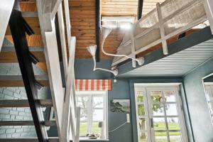 By The Bay A Thatched House Lies So Beautifully