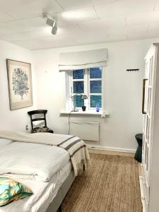 By The Bay A Thatched House Lies So Beautifully