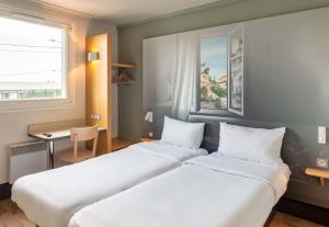 Hotels B&B HOTEL Lyon Grand Stade Meyzieu : photos des chambres