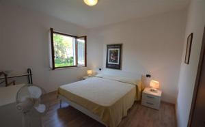 Private fenced garden house at 300mt from Lignano Pineta beach