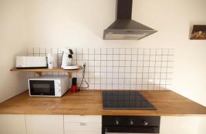 Appartements Charmante Maison de village Clim et Wifi : photos des chambres