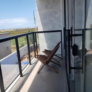 loft charmoso com lareira, a beira mar