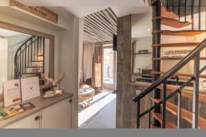 Maisons de vacances La Petite Escapade, maison avec jacuzzi privatif : photos des chambres