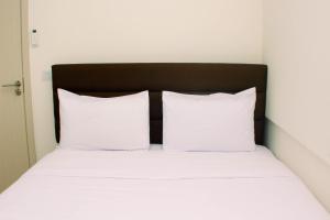 Comfort and Well Design 2BR with Working Room at Meikarta Apartment By Travelio