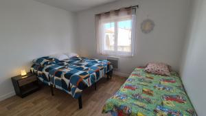 Appartements Maison plein centre ville a 100 m de la plage : photos des chambres