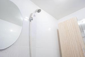 Homey and Fresh 2BR Green Pramuka Apartment By Travelio