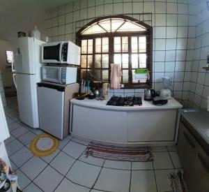 Suíte Nostalgia Ar refrigerado TV55" Canais free Pousada Tijucas Lua Encantada