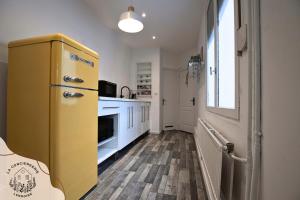 Appartements La maison citadine, avec garage : photos des chambres