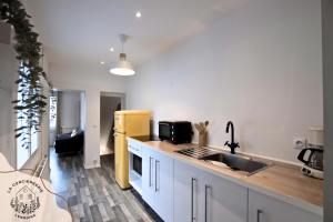 Appartements La maison citadine, avec garage : photos des chambres
