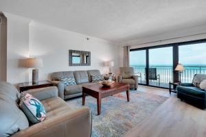 Large oceanfront balcony with pool & beach access located on the no-drive beach!