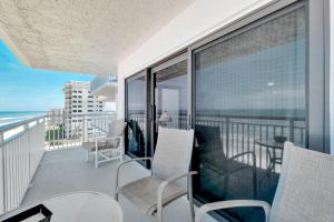 Large oceanfront balcony with pool & beach access located on the no-drive beach!