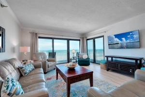 Large oceanfront balcony with pool & beach access located on the no-drive beach!