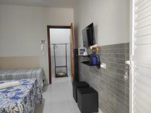 Suíte privativa no Bairro Custódio Pereira próximo ao Campus Umuarama UFU