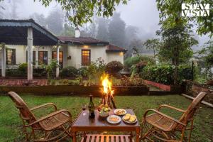 StayVista at Serenity of Sunny Side with TV, Lawn, Lake View