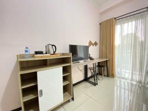 Cozy Living Studio at Gateway Pasteur Apartment By Travelio