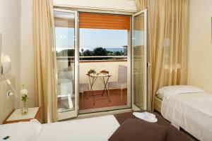 Quadruple Room with Balcony room in Hotel Nuova Sabrina