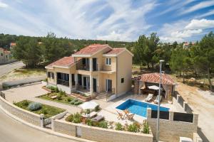 Beachfront villa Noa with heated pool