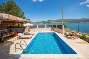 Beachfront villa Noa with heated pool