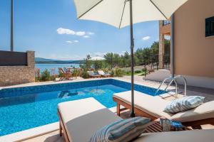 Beachfront villa Noa with heated pool