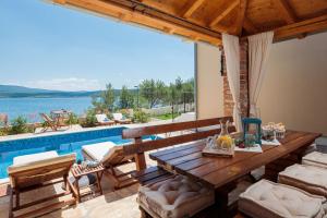 Beachfront villa Noa with heated pool