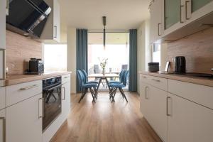 BeltBlick 4 - Moderne Ferienwohnung direkt am Strand mit Sauna und Meerblick!
