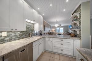 Top Floor Ocean and Pool Views located on No-Drive Beach with 2 Complex Pools