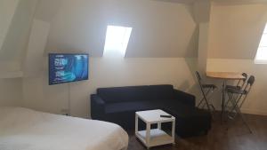 Hotels Au Pigeon Blanc : photos des chambres