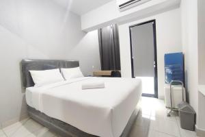 Cozy Living Studio at The Alton Apartment By Travelio