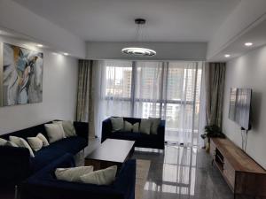 metro living retreat three bedroom apartment with swimming pool, fully equipped gym, ample parking space, and proximity to major shopping malls