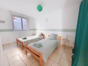Maisons de vacances Le 34 degres sud - 2 chambres - jardinet et jacuzzi : photos des chambres