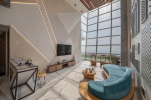 SaffronStays Nautica - 5BR hilltop villa with rooftop pool, sea views & modern interiors surrounded by greenery