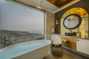 SaffronStays Nautica - 5BR hilltop villa with rooftop pool, sea views & modern interiors surrounded by greenery